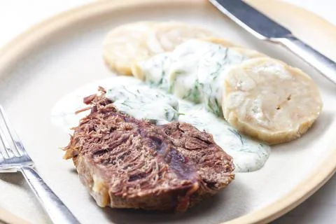 Beef meat with dill sauce and dumplings Stock Photos
