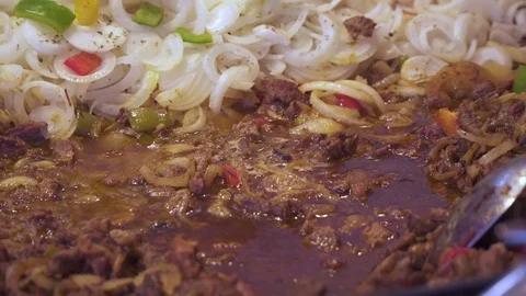 Beef meat is fried in frying pan with onions. Indian food. Close up frying meat. 스톡 동영상 80535713
