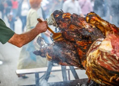 Beef meat at rolling skewer Stock Photos