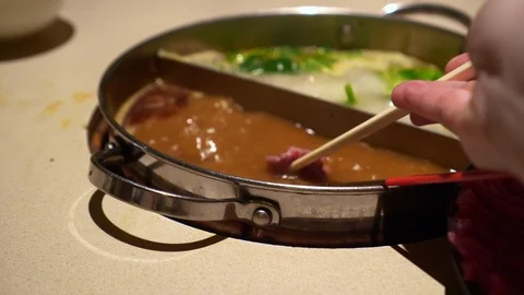 Beef meat slice eating in peanut hot pot soup Chinese winter food Stock-Footage 126471476