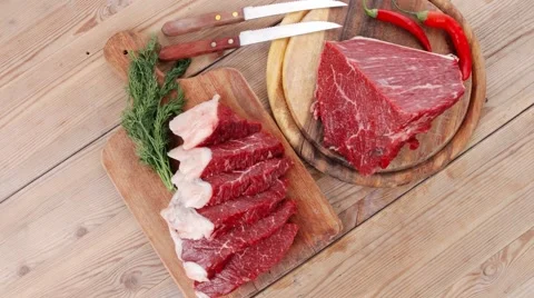 Beef meat steak and chunk on wood 库存影片 58764353