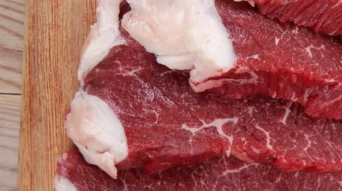 Beef meat steak and chunk on wood Stock Footage