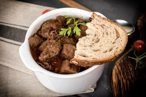 Beef meat stew in ceramic pot. Stock Photos