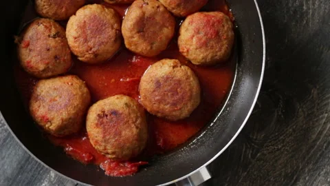Beef meatballs cooked in sauce ready to be eaten Stock Footage 152879561