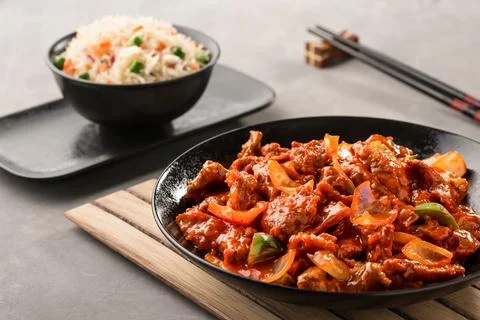 Beef Mongolian with Vegetable Fried Rice and chopsticks served in dish isol.. Stock Photos