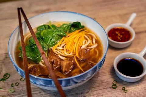 Beef noodle soup with vegetables, traditional Chinese food Stock Photos
