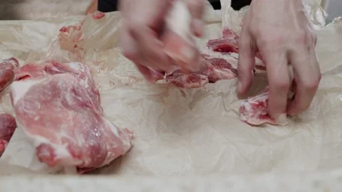 Beef is packed in paper. Raw meat packed in paper. Stock Footage 232867071