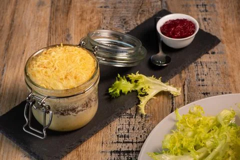 Beef pie recipe with red beet sauce cooked with chili spices and salad Stock Photos