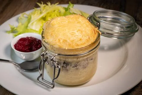 Beef pie recipe with red beet sauce cooked with chili spices and salad Stock Photos