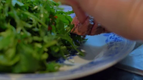 Beef on a plate with arugula Stock Footage 121086220