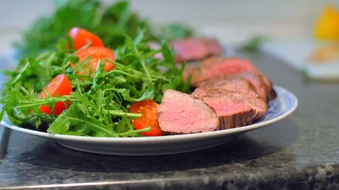 Beef on a plate with arugula Stock Footage 121086239