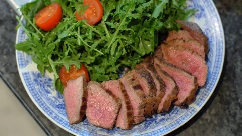 Beef on a plate with arugula Stock Footage 121086277