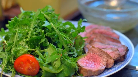 Beef on a plate with arugula Stock Footage 121086300