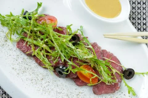 Beef with prepared dandelion Stock Photos