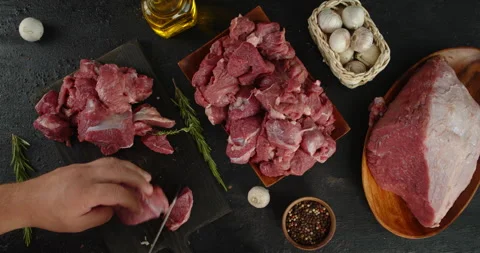 Beef raw is cut into pieces on a stone board. Stock Footage 139160423