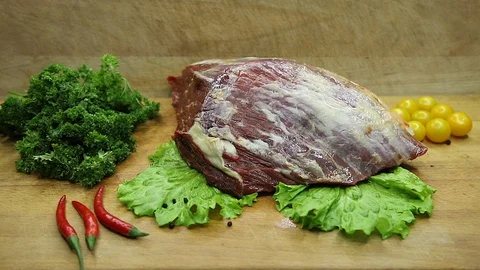 Beef, raw pieces of decor from the chef Stock Footage 130002788