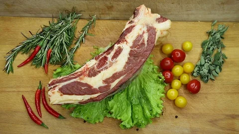 Beef, raw pieces of decor from the chef Stock Footage 130002795