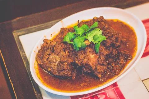 Beef Rendang.Tender beef shank slow-cooked to perfection with original Bumb.. Stock Photos