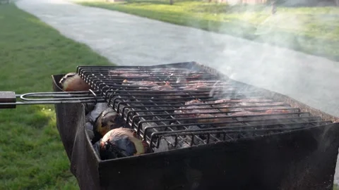 Beef rib steak cooking on black dirty barbecue. Stock Footage 163356548