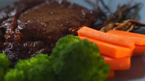 Beef Ribeye Steak with Vegetables Stock Footage 138268426