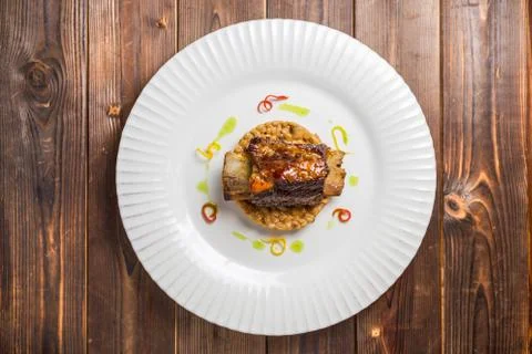 Beef ribs on a bed of oatmeal Stock Photos