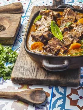 Beef ribs Bourguignon. Beef ribs stewed with carrot, onion in red wine. France Stock Photos