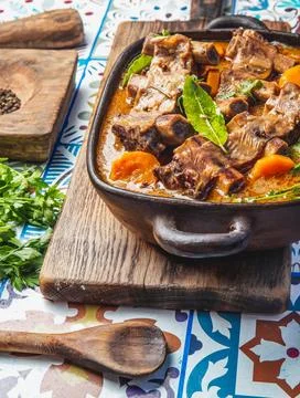 Beef ribs Bourguignon. Beef ribs stewed with carrot, onion in red wine. France Stock Photos