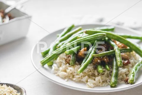 Beef with rice and green beans Stock Photos