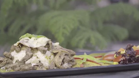 Beef, rice, mozzarella cheese and vegetables rotating on plate. Stock Footage 78091181