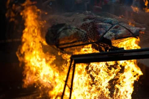 Beef roasting on a spit Stock Photos