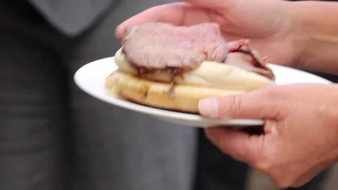 Beef roll being served at a BBQ Stock Footage 80436466