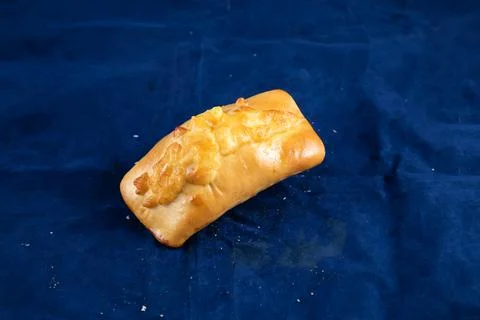 Beef Roll isolated on blue background side view of savory snack food Stock Photos