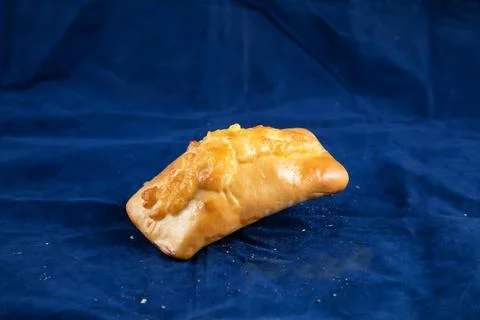 Beef Roll isolated on blue background side view of savory snack food Stock Photos