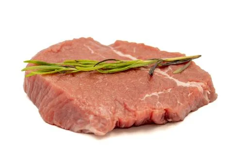 Beef round slice isolated on white background. Raw beef round with herbs and  Stock Photos