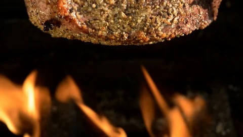 Beef Rump Roast with dry rub seasoning on open flame rotisserie Stock Footage 116260284