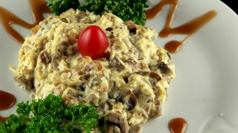 Beef salad with grated celery root, fried mushrooms and mayonnaise, loop Vídeos de archivo 61710737