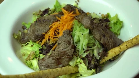 Beef salad with vegetables, Rotating shot. Stock Footage 69842513