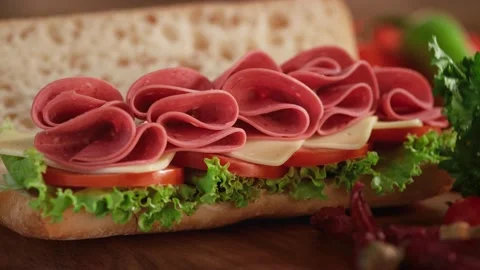 Beef salami sandwich with  served on a dining table. Video stock 140514586