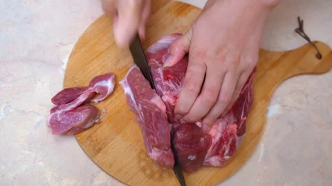 Beef slicing at home. Closeup of beef being sliced in domestic kitchen Video stock 328494290