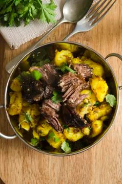 Beef with spiced potatoes Stock Photos