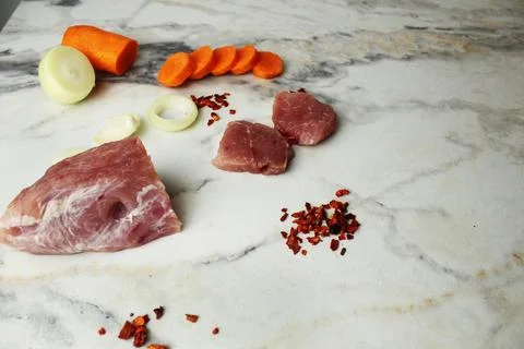 Beef with spices and vegetables on the table. Homemade food Stock Photos