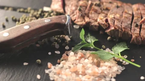 Beef steak on a board with spices Video stock 66443174