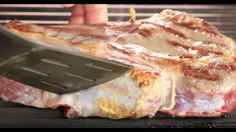 Beef steak on the bone on the grill. Stock Footage 208688034