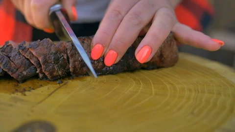 Beef steak cooked medium well cut sliced knife Stock Footage 128759640