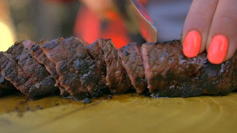 Beef steak cooked medium well cut sliced knife Stock Footage 128759997
