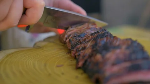 Beef steak cooked medium well cut sliced knife Stock Footage 128760903