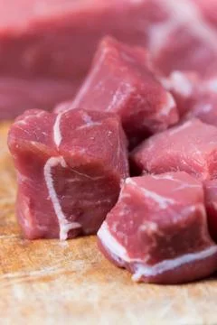 Beef steak cut into cubes. Red meat on the cutting board Stock Photos