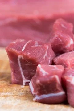 Beef steak cut into cubes. Red meat on the cutting board Stock Photos