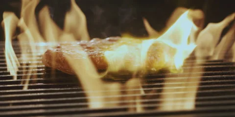 Beef steak falls on grill Video stock 247385755