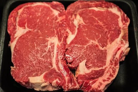 Beef steak. Fresh raw beef steak top view. Raw rib eye steaks on styrofoam .. Stock Photos